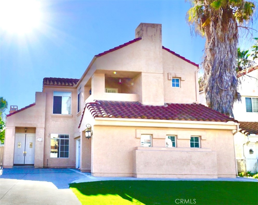 BEAUTIFUL 4 BEDROOM HOME OFFERING A PERFECT BLEND OF ELEGANCE AND COMFORT. THE LARGE KITCHEN FEATURES GRANITE COUNTERTOPS, ABUNDANT CABINET SPACE, STAINLESS STEEL APPLIANCES, AND A DOUBLE OVEN, WITH AN ELECTRIC COOKTOP – PERFECT FOR ENTERTAINING. STEP INSIDE TO SOARING 10-FOOT CEILINGS ON THE MAIN LEVEL AND AN IMPRESSIVE 18-FOOT, TWO-STORY FOYER AND FORMAL LIVING ROOM. ENJOY COZY EVENINGS WITH THREE FIREPLACES LOCATED IN THE FAMILY ROOM, LIVING ROOM, AND MASTER SUITE. STAIRCASE LEADING TO UPSTAIRS INCLUDES ROD IRON SPINDLES, VAULTED CEILINGS ADD CHARM TO THE SPACIOUS BEDROOMS. THE MASTER RETREAT BOASTS DOUBLE FRENCH DOORS LEADING TO A PRIVATE MASTER BALCONY, WHILE THE BATHROOMS SHOWCASE GRANITE COUNTERTOPS AND CERAMIC TILE FLOORING THROUGHOUT. NO CARPET IN THIS HOME! 3 CAR ATTACHED GARAGE. OUTSIDE, THE BACKYARD OFFERS PLENTY OF ROOM FOR KIDS TO PLAY OR FOR WEEKEND GATHERINGS. BOTH FRONT AND BACKYARD HAVE TURF GRASS TO HELP WITH LOWER MAINTENANCE & WATER COST. CONVENIENTLY LOCATED NEAR SHOPPING AND FREEWAYS.