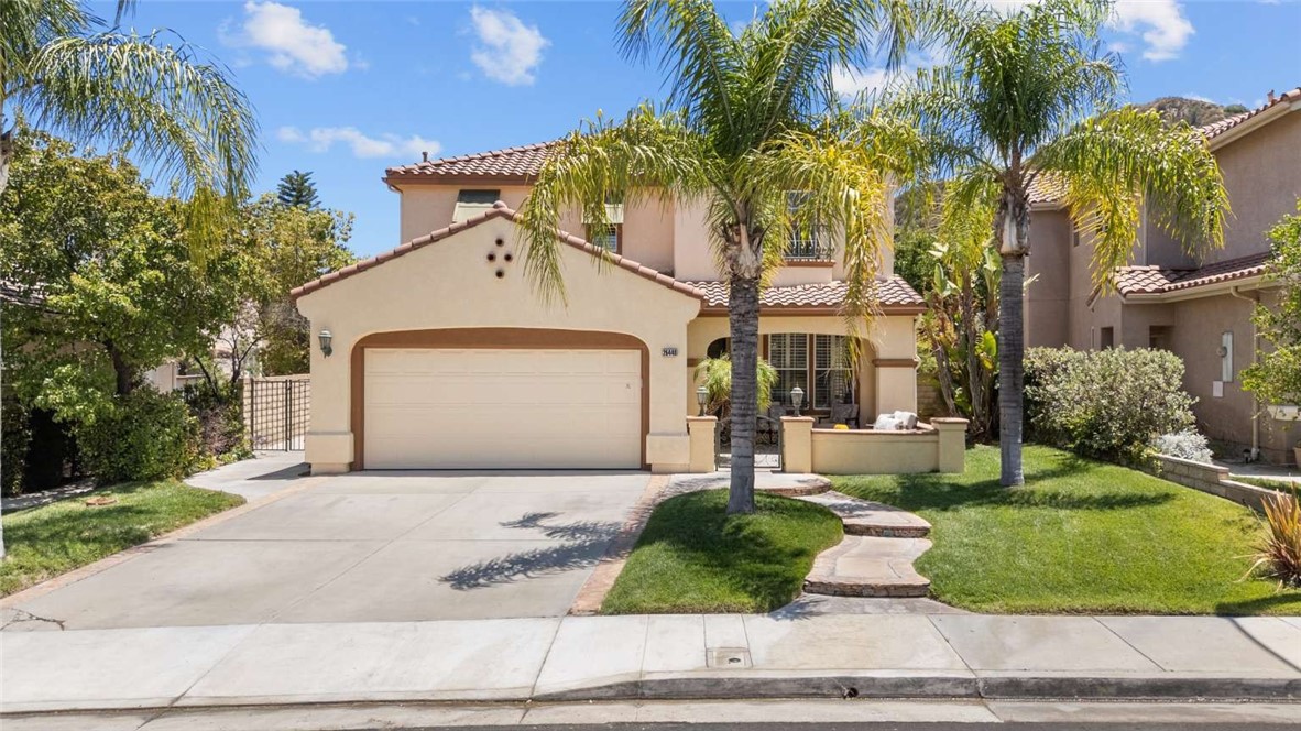 Welcome to your very own 5 bedroom 3 bath "Atessa" home in a highly sought after and established neighborhood in Stevenson Ranch! Award-winning schools. Low HOA. No Mello Roos. Enter the home through the courtyard entry! This light-filled, open-concept home boasts expansive windows, 9-Ft ceiling all throughout, upgraded bamboo flooring, formal living and dining area flows into the cozy great room with a fireplace, overlooking the serene backyard, providing a seamless blending of indoor and outdoor living. The ground level also features a spacious bedroom with full bath perfect for accommodating guests or multigenerational living. The Chef’s dream kitchen is equipped with newer (within the last 5 years) stainless-steel appliances, sleek granite counter tops, center island, ample cabinet spaces and a layout perfect for entertaining. Head to the second level where you will discover a wealth of hallway storage, ensuring a clutter-free living environment. Wake up to breathtaking mountain views from the king-sized primary suite featuring direct access to the primary bathroom offering a gorgeous walk-in shower, a spacious vanity, dual sinks, and a generously sized walk-in closet with custom organizers. You will also find upstairs the three additional well-appointed oversized bedrooms and a full bathroom with dual sinks and updated shower to share. Stepping outside, you'll find a private and giant backyard big enough for any pool you would want to build. The home also features an incredible "whole house fan" for inexpensive home cooling and energy saving! Newer A/C Unit within the last 4 years and Water heater and Refrigerator within the last 2 years . Good spacing between homes on both sides. Just a couple of minutes from restaurants, groceries, shopping and freeway! Outdoor enthusiasts will love the approximately 80 miles of picturesque trails and 20 miles of paseos designed for commuting and recreational use, including walking, bike riding, jogging, and skating. Just a short stroll away you’ll find Richard Rioux Park: A 17-acre park with vast fields and scenic views. It includes sports fields, a playground, walking paths, and has its own 4th of July fireworks display. And indulge in yearly spectacular Halloween night displays in your own Brooks Circle featuring Walk-Through Haunted Houses, Yard Displays, Trunk-or-Treat and Fairs, Movies and Plays as part of the SCV Halloween Haunts. This home truly has it all and is waiting for its new owner.
