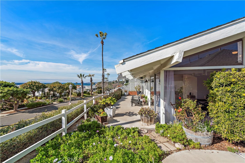 Welcome to your serene coastal retreat in the highly desirable 55+ community of Colony Cove, just moments from the beach in San Clemente. This charming single level, two bedroom home combines comfort, convenience, and stunning ocean views. The bright and open floor plan is filled with natural light from large windows and sliding doors, creating a seamless connection between indoors and outdoors. The spacious living room features a cozy brick fireplace, perfect for cool coastal evenings, and opens to a generous ocean view patio - ideal for morning coffee, entertaining, or simply soaking in the sea breezes. The primary suite offers ample storage, a ceiling fan, and an airy ensuite bathroom that looks out to a private atrium, bringing in light and tranquility. The secondary bedroom is perfect as a guest room or office, with windows framing views of the ocean. Step outside and enjoy beautifully landscaped community grounds with peaceful walking paths, California coastal vegetation, and access to a community pool and clubhouse. From the bluffs above the ocean, you’re just a short walk to sandy shores where you can take in sweeping views from Dana Point to the San Clemente Pier and experience the breathtaking sunsets the area is known for. Conveniently located near the San Clemente Outlets, Sea Summit walking trails, Dana Point Harbor, and vibrant downtown shops and restaurants, this home offers the best of coastal living - relaxed, scenic, and close to everything. Don’t miss the chance to embrace a lifestyle of beauty and tranquility in this exceptional ocean view home.