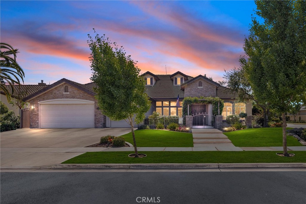 Welcome to Brighton Estates, one of Bakersfield's most desirable gated communities! This stunning 4-bedroom, 2.5-bath home sits proudly on a spacious corner lot and offers over 2,500 sq ft of well-designed living space. This residence features a highly sought-after split-wing floor plan, with three generously sized bedrooms on one side and a luxurious master suite on the other - perfect for privacy and comfort. Step inside to an open-concept layout where the heart of the home shines. The gourmet kitchen boasts granite countertops, ample cabinetry, and a functional island that overlooks the expansive living room with a cozy gas fireplace. Outside, enjoy your private oasis featuring an oversized in-ground spa with a tranquil rock waterfall, a large, covered patio for year-round outdoor living. A spacious 3-car garage offers plenty of room for vehicles, storage, or a home gym setup. This beautiful property combines elegance, comfort, and convenience so make it yours today!