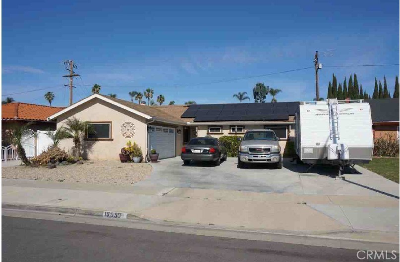 This property features a rectangular lot, a front and rear yard, a large covered patio, on-site garage parking, a fireplace, a tankless water heater, and standard energy efficient items typical for the market area. It is well maintained inside and out, with no significant deferred maintenance or physical deterioration. It was fully remodeled approximately 8 years ago and updates include a new roof, new windows, new doors, remodeled kitchen, new appliances, remodeled bathrooms, new flooring, new plumbing and electrical, new insulation, new recessed lighting, a new patio, and new landscaping throughout. Solar system installed.