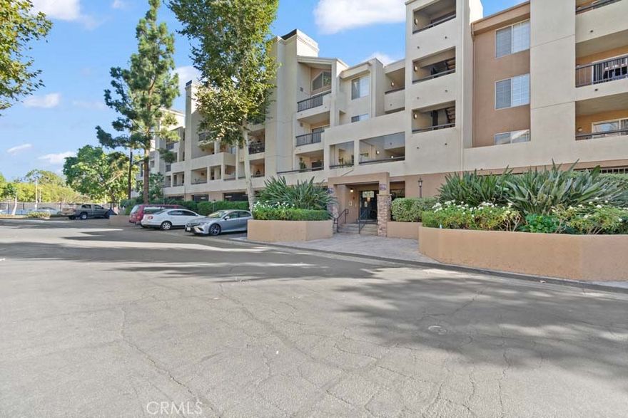 Welcome to the Prestigious MET at Warner Center.  Experience resort-style living in one of the most sought-after communities in the area, complete with 24-hour guard-gated security. This is a perfect opportunity to own and live in a beautifully maintained, upscale environment. This desirable third-floor unit features 2 bedrooms and 2 bathrooms, offering soaring ceiling in the living room, a bright and airy interior, a fireplace, and the convenience of an in-unit washer and dryer. The kitchen has been tastefully updated with modern cabinetry, stainless steel appliances, upgraded flooring, and stylish lighting. Enjoy a wealth of amenities within the community, including multiple swimming pools and spas, six night-lit tennis courts, a fitness center, racquetball and basketball courts, a children’s playground, outdoor seating areas, and lush greenery throughout the grounds.  The unit includes a designated tandem parking space for two cars. Ideally located, The MET is just a short walk to Ventura Boulevard’s shops and restaurants, and only minutes from Westfield Topanga and The Village, offering premier dining and shopping options.