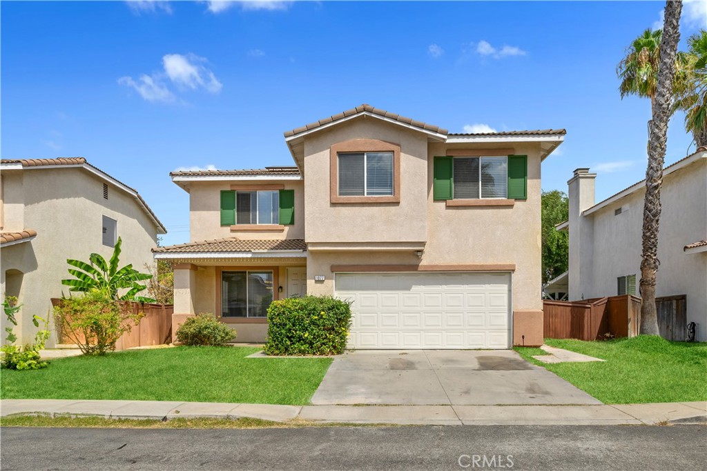 Nestled within a gated enclave in north Pomona.The home embraces practicality and comfort a layout in which all bedrooms including the master suite are situated upstairs. The ground floor opens up to a welcoming living room and a kitchen area, complemented by a convenient half bath. The heart of the space features an upgraded kitchen with a central island that flows seamlessly into a spacious family room, anchored by a cozy fireplace that invites warmth and gatherings during cooler months. The home has been refreshed with newer paint , Vinyll flooring throughout, bathroom countertop and LED lights. Upstairs the four bedrooms are providing ample room for family, guests, or flexible uses such as an office or hobby space. In the backyard, the fruits trees create a delightful setting for relaxation or weekend fruit picking. 1077 Hibiscus Court stands as an embodiment of tranquility meeting convenience. Its proximity to both the I-10 and I-60 freeways positions it perfectly for easy commuting and access to shopping and schools while retaining a peaceful residential ambiance. The neighborhood, known for its suburban charm, was built upon former ranch land and maintains a diverse, working- to upper-middle-class character.
