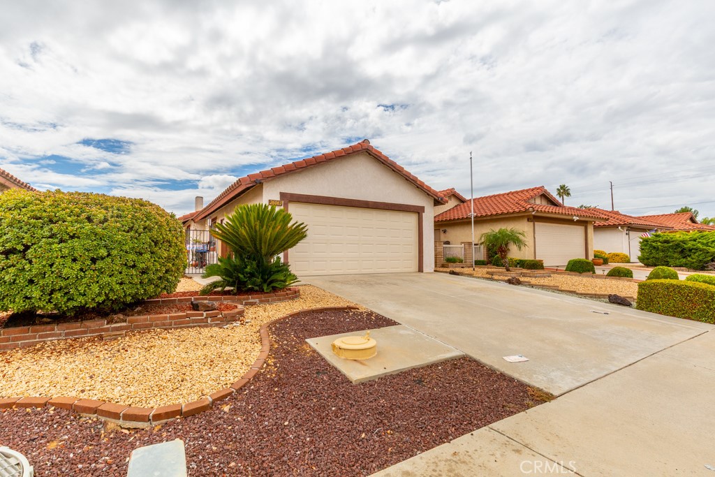 Charming, quaint and cozy! Located in a Desirable 55+ Community in Menifee!
Welcome to this beautifully maintained 2-bedroom, 2-bathroom home located in a peaceful 55+ community in the heart of Menifee. Offering brand new luxury tile flooring throughout. This inviting property features a spacious floor plan with a custom designed sunroom that is well thought out with quality windows and lighting. Its unique space is perfect for relaxing or entertaining year-round.
The primary bedroom offers a walk-in closet and an upgraded en-suite bathroom for added comfort and convenience. The home also includes leased solar to help keep energy costs low—buyer to assume solar lease.
Enjoy the low-maintenance drought free yard, complete with mature orange and lemon trees, offering fresh citrus and a touch of nature. Additional highlights include low property taxes and a low monthly HOA, making this an ideal choice for those looking to enjoy affordable, active adult living.
Don’t miss your chance to own this lovely home in a quiet, established neighborhood close to newer retail shops, dining, and medical facilities!