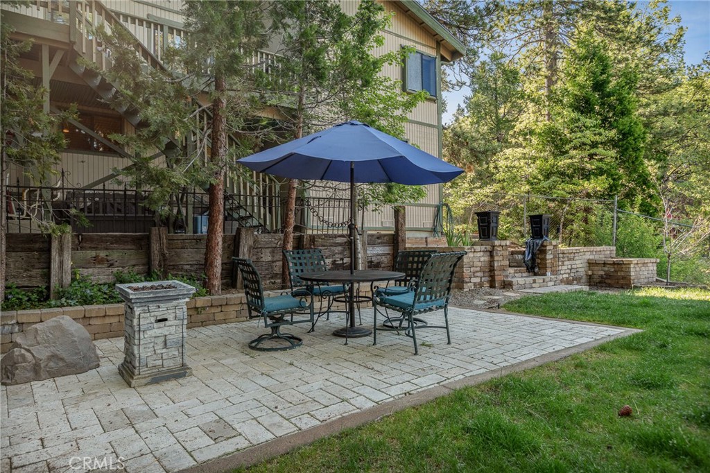WOW, WOW, WOW!!! This Home Has the Perfect Blend of RUSTIC & MODERN!!! It is ABSOLUTELY STUNNING with Hard Wood Flooring & High Ceilings Throughout, Windows Everywhere Bringing in the Natural Light and Knotty Wood Walls! There is Level Entry into Home with an Inviting Open Floor Plan and a Gorgeous Floor to Ceiling Stone Fireplace! There are 3 Bedrooms and 2 Baths all on the Same Floor Which Makes for SUPER EASY LIVING HERE! Downstairs Apartment is Permitted and Can Be Accessed from the Outside or Down the Stairs from the Main Home. The Apartment is VERY SPACIOUS and OH SO CUTE!!! Adorable Kitchen Includes Full-Sized Refrigerator, Stove and Dishwasher with CONCRETE COUNTERTOPS! Living Room is Cozy with Built-in Bookshelves and French Doors Open to a Private Office. Bedroom and Bath are Tucked in the Back!!! YOU WILL LOVE the AMAZING USABLE FENCED BACKYARD with Grass!! RV/Boat Parking Upfront too!! 2-CAR GARAGE with Additional Parking in the Driveway. This is One of those Special Homes that Rarely Hits the Market. Don't Miss it!!
