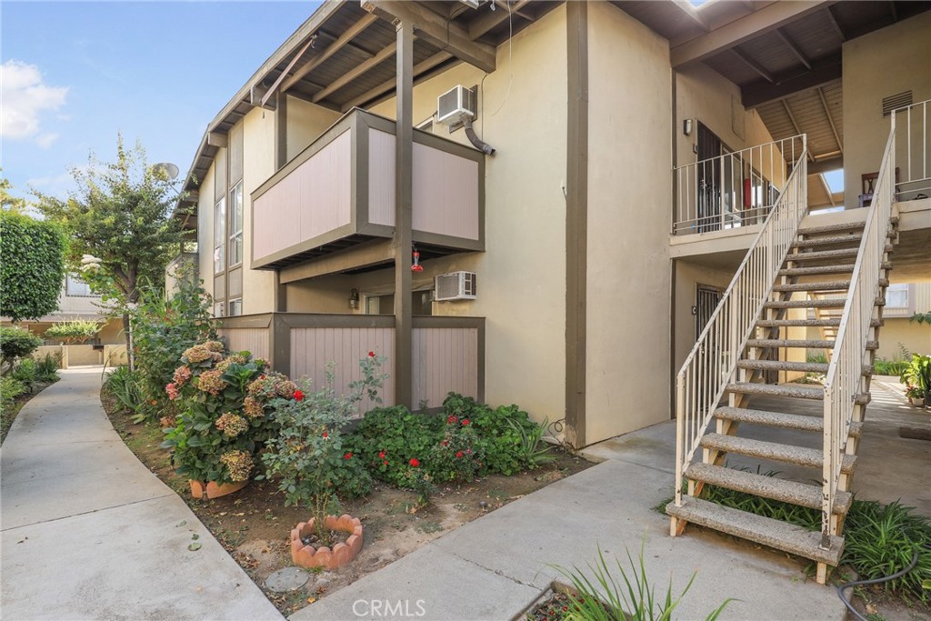 LOTS OF LIGHT! Ground floor condo in Mariner's Park! Super convenient interior location. Gated community, on site HOA management! Upon entry, enjoy the open concept living, dining and kitchen complete with a private patio. Perfect space for outdoor dining set and/or to decorate with potted plants. Kitchen is updated with Shaker style cabinets, granite countertops plus newer stainless steel microwave, range and dishwasher. AC wall unit! Spacious bedroom with walk-in closet. Bathroom has tub/shower combination and a lovely storage area, newer vanity/fixtures. Conveniently located, close to the front gate, visitor parking area, short distance to the mailbox area, community laundry and parking spot. Commuters will appreciate the nearby access to 110 and 405 freeways, shopping and additional South Bay living options! Community Pool and entertaining area, playground too!