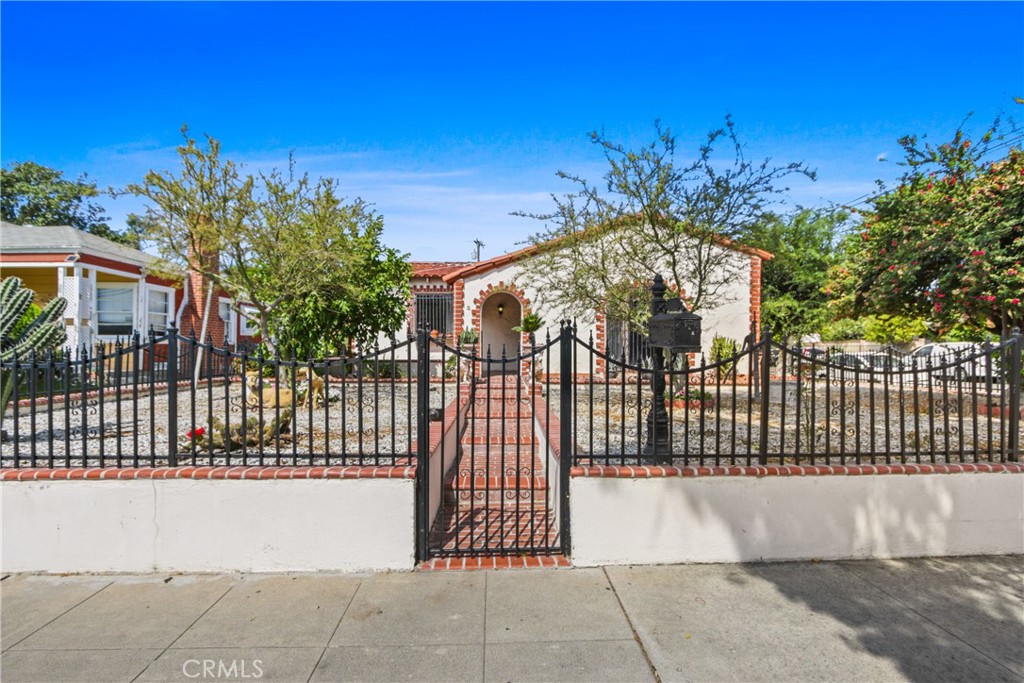 Welcome to this charming Spanish-style 3-bedroom, 1-bathroom single-family residence, ideally situated on a desirable corner lot and offering both comfort and potential. Classic details like a tile roof built to last for many years, a cozy wood-burning fireplace, and a blend of wood and tile flooring bring timeless character to the home. Inside, you’ll also find central heating, inside laundry, and plenty of natural light across the main level.
Outside, a detached 2-car garage has been converted into a 1 bed/1 bath with a small kitchen. (Not permitted. Buyer to verify permits and intended use with the City of Santa Ana.) This flexible space is perfect for guests, extended family, or additional income opportunities.
Located within the Santa Ana Unified School District, this property also provides easy access to shopping, dining, schools, and freeways.
Whether you’re ready to move in or make it your own, this Spanish-style gem with a durable tile roof offers charm, value, and versatility all in one!