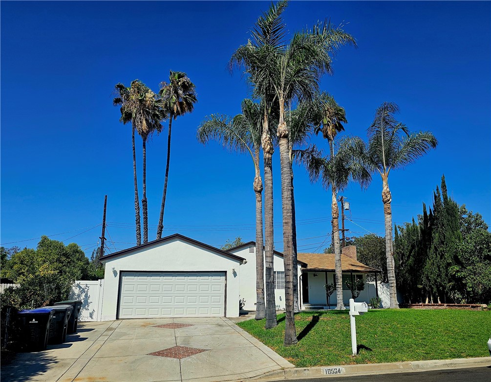 Now Available for immediate move-in! Single story home with 3 bedroom, 1 bath, living room with fireplace, 2 car garage with newly installed epoxy flooring, newly insulated and painted walls. Inside, the property has been mostly renovated with newly painted neutral walls, new lighting fixtures, new wood laminate flooring, kitchen with new quartz counter tops, fixtures, and kitchen appliances. New bathroom fixtures and newly installed A/C. Every bedroom had newly installed ceiling fans in every bedroom. All windows and sliding doors are double paned with new window blinds. New backyard fence with backyard big enough for entertaining. Newly installed pergola and sprinkler system. Lease for this turn -key home includes a weekly gardening service.