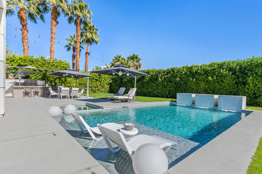 Crafted by Foxx Homes, this BREATHTAKING residence in the sought-after Sterling Cove community in Rancho Mirage offers sophisticated design and LUXURIOUS finishes, curated by a renowned local interior designer. With 3 spacious bedrooms and 3 stylish bathrooms, this Turnkey FURNISHED home features a cozy fireplace in the family room and an open-concept layout--perfect for entertaining, A unique highlight is the player piano, once owned by the legendary Zsa Zsa Gabor, adding a touch of Hollywood glamour to the home. Soaring ceilings and abundant natural light create an inviting atmosphere throughout. Step outside into your own tropical oasis, complete with a STUNNING pebble tech pool and spa, elegant water fountains, and a fully equipped OUTDOOR KITCHEN with a BBQ. This exceptional home embodies the ultimate Southern California desert lifestyle.. 1 YEAR LEASE. Minimum of 5 month lease available for $16,000/month or BEST OFFER!
