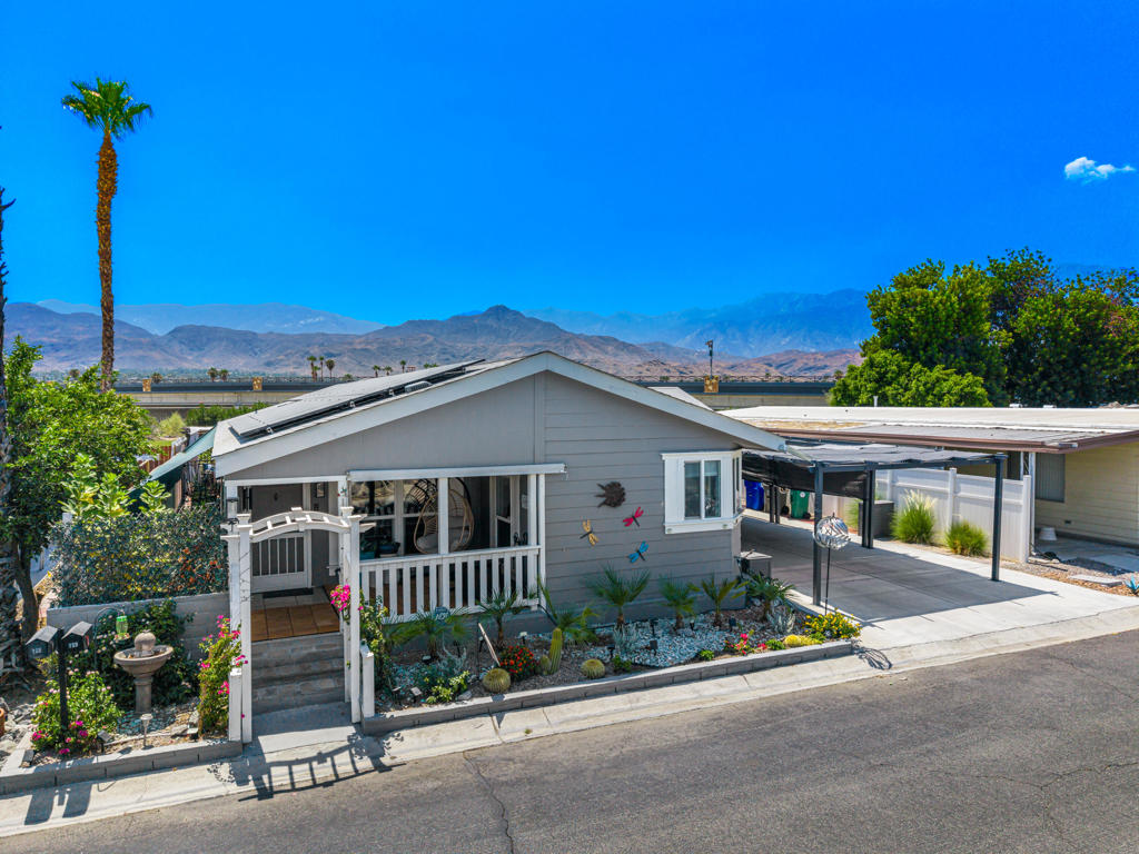 This spacious home offers 3 bedrooms, 2 baths, plus a versatile bonus room that's currently used as an office. With 1,512 sq. ft. of open-concept living, the home feels even larger thanks to its bright and airy layout.Built in 2004 and stylishly updated in 2023, the home features modern touches such as quartz countertops and fresh interior and exterior paint. A brand-new AC system was also recently installed, ensuring year-round comfort and efficiency.Enjoy a cozy front porch perfect for relaxing, or step into the large backyard with a covered patio and additional pergola designed for outdoor dining and entertaining. There's a bonus room off the patio that can be used as an office, lounge, or extra storage.Practical features include an attached 2-car garage with ample storage, a double-wide driveway (no tandem parking), and a pergola over the driveway to help keep cars cool in summer. Energy efficiency comes easy with leased solar panels and a backup power wall to keep your home running smoothly even during outages.Date Palm Country Club is a vibrant 55+ gated community in south Cathedral City, offering top-notch amenities including an 18-hole golf course, driving range, tennis and pickleball courts, multiple pools and spas, a clubhouse, fitness center, restaurant, pro shop, and a dog park.