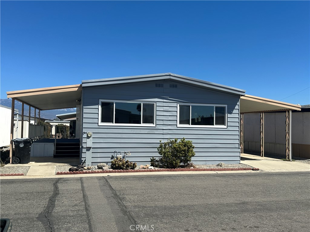 Welcome to A Move-In Ready, Newly Renovated Gem in a Gated 55+ Community of Sunburst MobileHome Park! This Beautifully Renovated Home has NewCarpeting, HVAC, and Huge Glass Windows. Its Spacious Interior features Open Layout, a truly turnkey ready for its new owner. The spacious interior features newly interior and exterior paint. The gorgeous kitchen has wood cabinetry & elegant countertops, double oven, stainless steel stove and dishwasher, new faucet and a garbage disposal, washer and dryer. Enjoy the morning breeze and a of coffee, or a cool evening in the large front patio. A generous 2-car covered carport with a storage shed behind. Sunburst Mobile Home Park offers a clean, quiet, and friendly senior community that is meticulously maintained. You'll love the Park amenities with the inviting lobby, library, spacious clubhouse, barbecue area, sparkling blue pool, jacuzzi and a billiard hall. The central location is just minutes away from the Hemet Valley Mall, Hemet Global Medical Center, Walgreen, Walmart Neighborhood Market, Target, Smart and Final, Grocery Outlet, Hemet DMV, the Social Security Office, Banks, Inn and Out, McDonalds, Starbucks, Asian Store and various restaurant you will enjoy!!!
