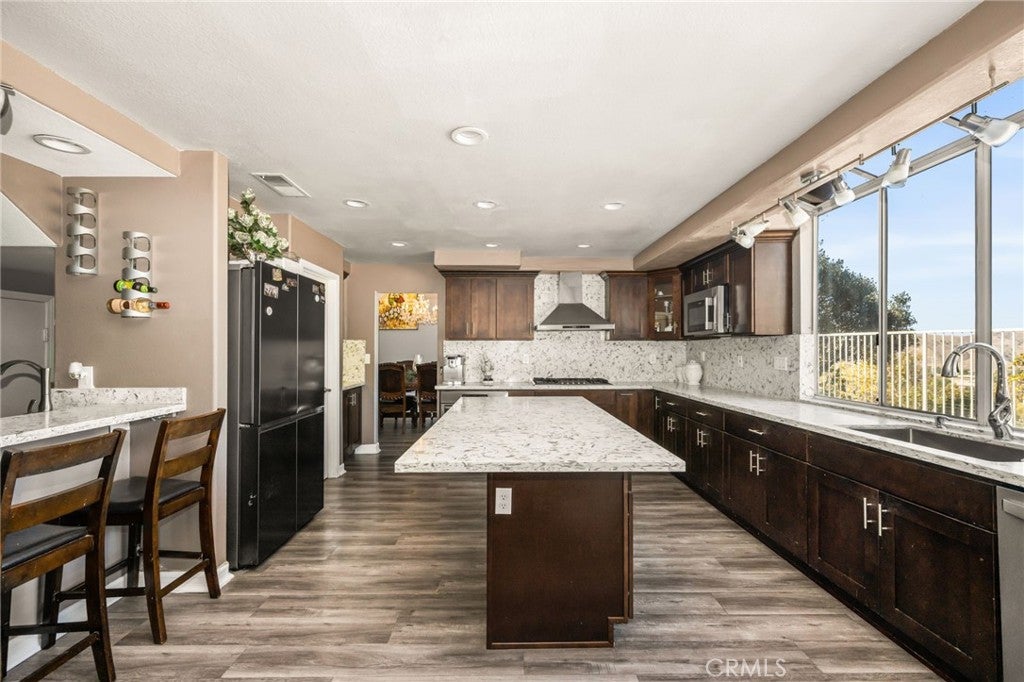 Photo of 4061 Mount Serenata CIR, Corona, CA 92882 (MLS # PW26220930)