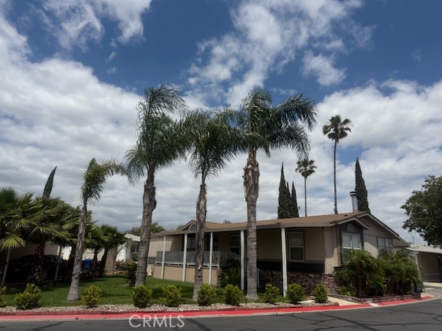 Country Meadows Home Community offering a beautiful Mobile Home that features, 3 bedrooms and 2 full baths, spacious Living area, 2 Living rooms, Fireplace, Dining Room, Kitchen, Laundry Room, lots of Storage, Air Conditioner, New Roof, Yard with grass and Sitting area. Carport (3 spaces available). Plenty of Visitor Parking. HOA offers 2 Pool areas, Jacuzzi, Basketball Courts, Kids Playground and maintains the grounds clean and welcoming. This is a must see mobile home, location is prime and in a very desirable area.