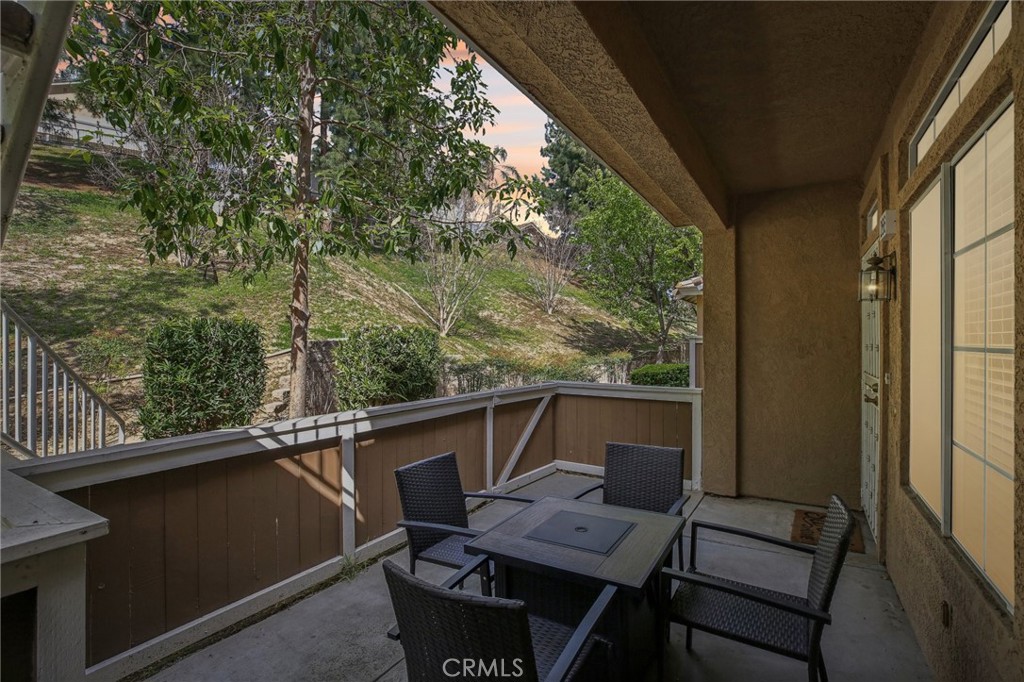 Nestled in the desirable Hillsborough community of La Mirada, this beautifully updated downstairs, main-level, single-story condo offers comfort, convenience, and modern upgrades. The inviting front patio provides a serene setting with lush landscaping views, perfect for relaxing outdoors. Inside, the home boasts wood laminate flooring, neutral gray paint, recessed lighting, and a cozy fireplace in the living room. The stylish kitchen has been renovated with new designer cabinets, granite countertops, and matching white appliances, creating a sleek and functional space. The spacious master bedroom includes a walk-in closet, offering plenty of storage, while the upgraded master bathroom features new white cabinets, granite countertops, and a beautifully tiled shower with glass doors. Additional highlights include central air conditioning and heating, a one-car attached garage with washer and dryer hookups, and ample guest parking. Residents can enjoy resort-style HOA amenities, including a pool, two spas, and a BBQ area with tables. Conveniently located near shopping centers, golf courses, restaurants, and more, this home is a fantastic opportunity for those seeking a move-in-ready property in a prime location.