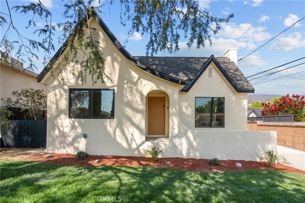 Welcome to this charming Spanish Colonial Revival home nestled in the heart of Burbank’s sought after Bel Aire neighborhood. This beautifully remodeled two-bedroom, one-bath residence features a classic Jack-and-Jill bathroom and a spacious open layout. Enjoy the elegance of recessed lighting throughout and the peace and quiet provided by double-pane windows that keep any noise at bay. One of the standout features is the Batchelder-tiled fireplace, adding a touch of historic charm and craftsmanship to the living space. The home also boasts a two-car garage and a backyard with ample potential for an ADU or even a junior ADU. Located in a wonderful neighborhood with excellent schools, friendly neighbors, and plenty of amenities, this home is an investor’s special with significant rental potential. Come see the perfect blend of historic character and modern comfort!