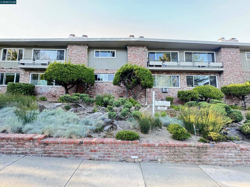 2 bedrooms. 2 full bathrooms. 1225 square feet of living space. Light updated kitchen with eating area. Beautifully updated bathrooms. End unit with large windows and abundant light. Huge great room for living and dining with cozy fireplace. Newer forced air conditioner and heater. Covered parking with 24/7 security cameras. Quaint 13 unit complex. Exterior storage closet included. Community pool. On site conveniently located community laundry. Walk to k-5 excellent schools. 2 blocks from bus. 2 blocks from downtown, and one block from the very beautiful Hacienda de Los Flores. No rental restrictions. HOA dues cover water, hot water, garbage, gardener, reserves, master hazards insurance, and all exterior maintenance. Welcome Home!
