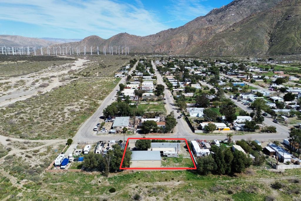 ATTENTION tradesman, small business owners and investors! Don't miss an opportunity to grow your business! This centrally located property features a 2 bed, 2 bath home on a 1/3 acre lot with an 1800 sq ft warehouse/garage/workshop that is perfect for storing equipment, work vehicles, or even RV's! The structure comes complete with an upper loft and office space, perfect for a general contractor, HVAC company, welder, and more! Centrally located with easy freeway access, you will be able to service the Palm Springs/Coachella Valley area as well as the Banning/Beaumont/Redlands areas! The home features almost 1500 sq ft of living space with a beautifully updated kitchen that includes new stainless steel appliances and plenty of storage. This well maintained property has no neighbors or development behind the land and has some of the most incredible views of the Santa Rosa and San Jacinto Mountains. The property is fully enclosed and includes numerous citrus trees, low maintenance landscaping and a covered patio! Just minutes from the largest Outlet Mall in California, Desert Hills Premium Outlets, as well as Casino Morongo and a short drive to the shopping and dining of Palm Springs, you'll have to see it to believe it! Properties like this don't come along often so schedule your showing today and see all that this property has to offer.