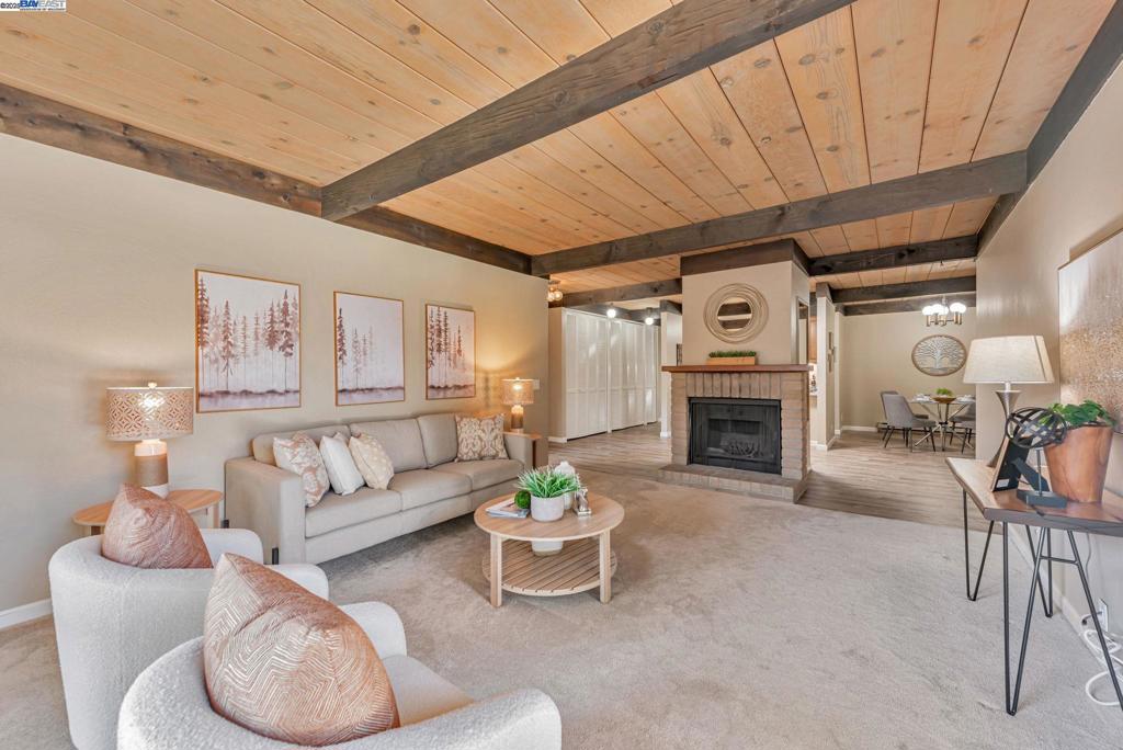 Upper-level model unit in one of Fremont’s most desirable communities—The Vineyards! This beautifully updated 2-bedroom, 2-bath condo features soaring ceilings with laminate flooring. The remodeled kitchen boasts newer cabinets, granite countertops, and a modern sink, while both bathrooms shine with stylish upgrades including new vanities and dual sinks in the primary suite. Enjoy natural light through skylights, a cozy fireplace, and wood-beam ceilings that add charm throughout. Step onto a large private patio with storage, ideal for relaxing or entertaining. Fully equipped with in-unit washer/dryer and recent window treatments. Gated community with pool and spa. Unbeatable location—right across from Fremont Hub (Target, Trader Joe’s, Marshalls, dining), minutes to Lake Elizabeth, I-880, BART, hospital, and library. This move-in-ready gem combines comfort, convenience, and character—don’t miss it!