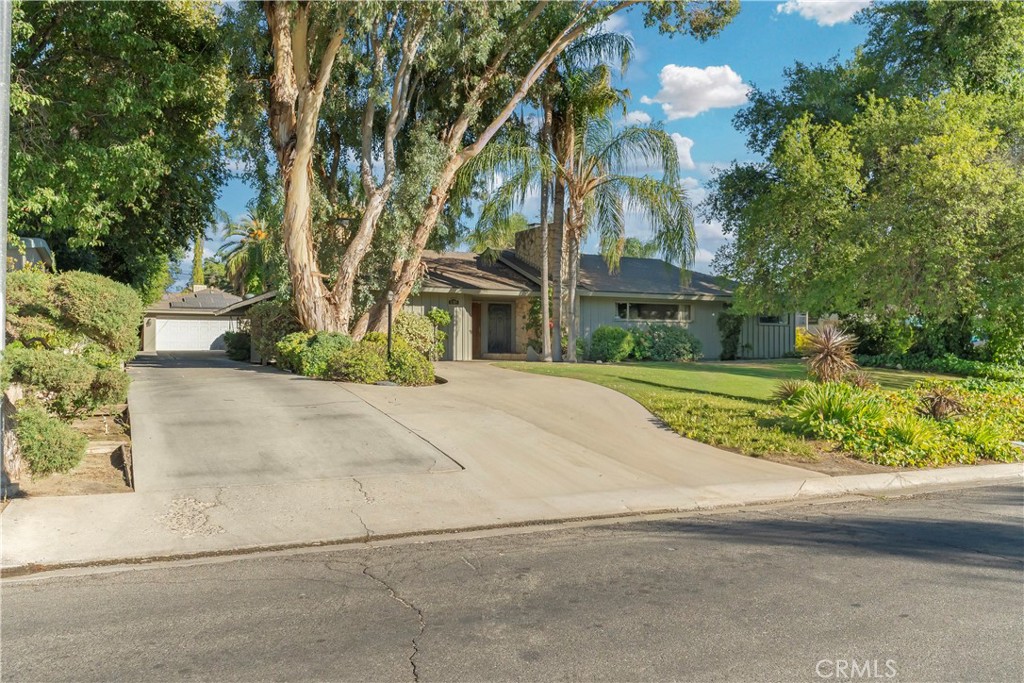 History, charm, and plenty of room to make it your own! This 1950s charmer boasts approximately 3,200 sq ft on over 1/3 of an acre, featuring a saltwater pool and pool house with a 1/2 bath, outdoor shower, ample covered patio areas, & RV parking. You'll never want to leave this special oasis.
Inside, you have 4 bedrooms, 3 baths, 2 fireplaces, a living room with large open windows overlooking the backyard, a family room with gorgeous stained glass and solid wood built-ins, a bar with a sink, and a patio window to serve your guests at all the parties and events you're about to host.
This one-of-a-kind home boasts numerous details and has the potential to be your dream home.