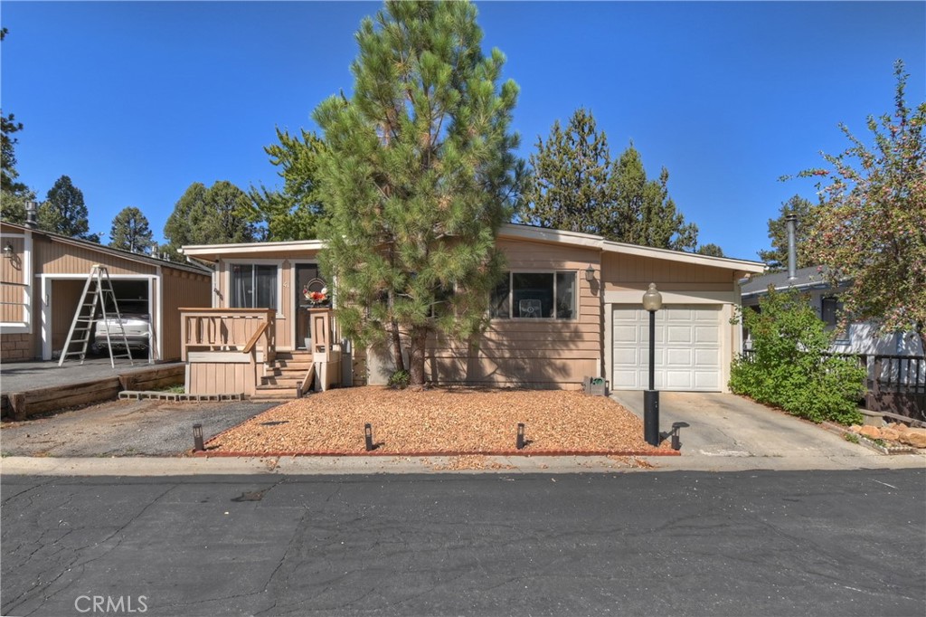 Welcome to Whispering Pines—spacious living on a prime outer street location! This 4-bedroom, 2-bath mobile home offers 1,088 sq. ft. of versatile living space designed to fit your needs. Two of the bedrooms can easily double as a den, office, or hobby space, giving you the flexibility to create the perfect setup for work or play. The primary suite is a true retreat, featuring a spacious closet and a slider that opens directly to the backyard. Step outside to enjoy a fully fenced yard with private gate access leading to open acreage that connects toward Sugarloaf Park—ideal for outdoor enthusiasts, furry friends, or those who value privacy and extra space. Inside, the floor plan is functional and inviting, providing plenty of room for entertaining or relaxing. Outside, storage is abundant, ensuring you have space for all your mountain gear, toys, and essentials. Whispering Pines residents enjoy fantastic community amenities, including a park, refreshing pool, and a huge spa/hot tub—perfect for unwinding after a long day. With its prime location, flexible living spaces, and access to both community and outdoor amenities, this home is a rare find in Whispering Pines. Whether you’re looking for a full-time residence or a mountain getaway, this property has plenty of room for everyone to enjoy.