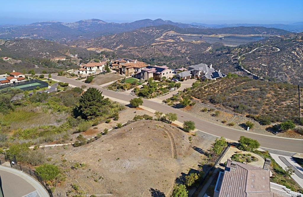 Discover unbeatable value and an extraordinary chance to build your dream home within the prestigious, gated community of Cielo. Set against a backdrop of tranquility, this homesite offers panoramic northwesterly views showcasing majestic mountains and breathtaking sunsets. Ideally located just a block from the private clubhouse, you’ll enjoy resort-style amenities including a sparkling pool, tennis courts, and more—all just steps from your future home. Adding to its appeal, the property comes with a complete set of architectural plans for a stunning 5,000 sq. ft. residence, thoughtfully designed to include a pool and professional landscaping. These plans are ready to be submitted for approval, saving you time and bringing you closer to realizing your vision. Don’t miss this rare chance to create a custom estate in one of the area’s most exclusive and serene communities.
