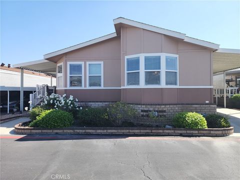 Photo of 9850 Garfield Ave #113, Huntington Beach, CA 92646 (MLS # OC26067259)