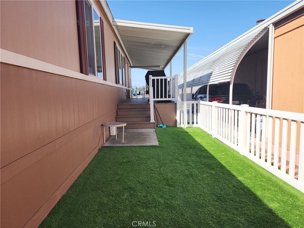 Photo of 9850 Garfield Ave #113, Huntington Beach, CA 92646 (MLS # OC26067259)