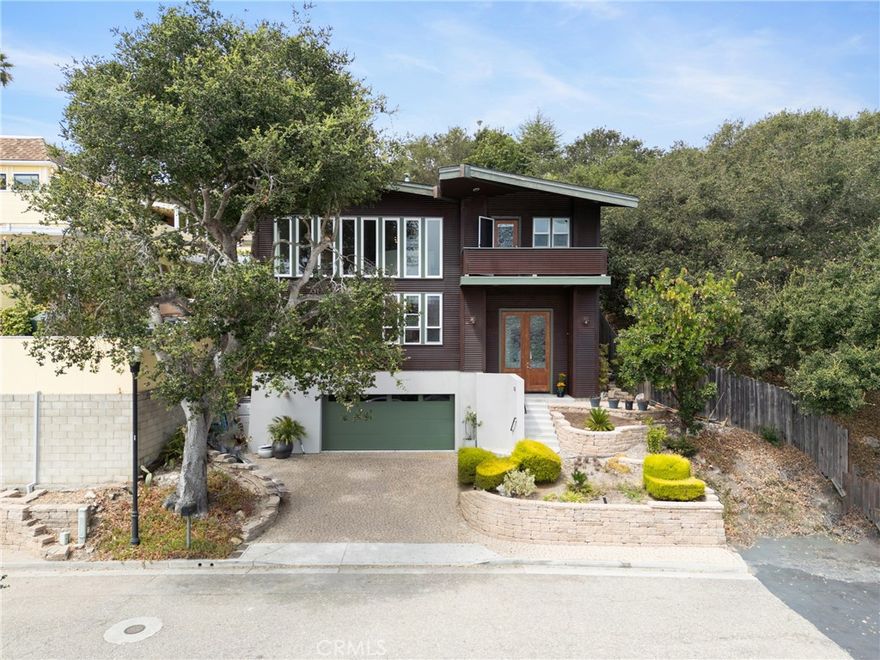 Great location nestled in the highly desirable Pismo Heights neighborhood, this one of a kind home features both privacy and convenience. Just minutes from the freeway, downtown Pismo Beach world class restaurants, coffee shops, grocer stores and local services for all your needs. walking distance to the beach and nature surrounds this quiet end of culdesac street. Unique architectural design. Built and designed by a local engineer. The exterior is clad in weathered corrugated steel, blending contemporary style with durability and potential fire resistance. Mature oak trees and palms surround the property, enhancing its natural beauty and providing a serene coastal retreat. Spacious living and entertaining 3 bedrooms, 3 baths, dedicated office room and Media room. 2 car garage. total square footage of 2638. The open floor plan seamlessly connects the living room, dining room and kitchen with a bar for extra seating. Large windows fill the interior with natural light and frame the views of the hillsides. Newly repainted and new carpet in all bedrooms. All other flooring is light bamboo and tile in baths. Must see this architectural dream home.