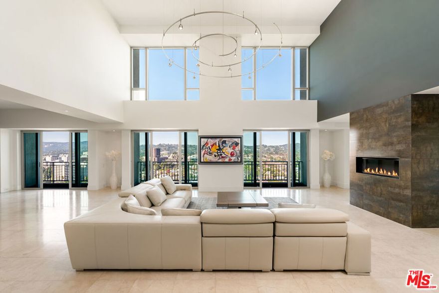 The penthouse at The Remington stands as a timeless statement of sophistication. An iconic residence where enduring style meets modern luxury. This exceptional two-story home captures the coveted northwest exposure, showcasing sweeping, world-class views that span Holmby Hills, UCLA, and the glittering Pacific Ocean. A direct-entry elevator sets an exclusive tone from the moment you arrive, complemented by a second interior elevator that effortlessly connects both levels of the home. Sunlight pours through expansive windows, illuminating every corner and framing dramatic vistas from nearly every room. Thoughtfully integrated smart-home technology enhances day-to-day living, offering seamless control and elevated convenience. An effortless blend of substantial single-family comfort with the ease of a refined pied--terre high above the city. Encompassing over 5,500 square feet, this penthouse offers the scale and presence of a private residence and ranks among the largest luxury units in Los Angeles. The grand primary suite features dual bathrooms and custom closets, accompanied on the upper level by a beautifully appointed guest suite. A third bedroom adjacent to the kitchen, along with a spacious first-floor office, creates an ideal layout for those accustomed to single-family living. Renowned as one of Los Angeles' premier full-service buildings, The Remington offers world-class amenities including valet parking, a state-of-the-art fitness center, salon, pool, and an exceptional five-star staff dedicated to an effortless lifestyle.