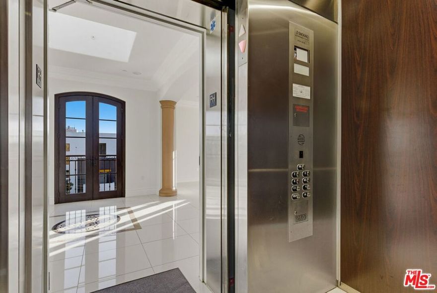 Presenting a rare, top-floor penthouse residence located in the esteemed Beverly Hills. Occupying the entirety of the building's top level, the private elevator opens directly into the unit, offering unparalleled privacy and convenience. Upon entry, an expansive open-concept living area is illuminated by abundant natural light streaming through large windows and elegant French doors. Pristine white tile flooring extends throughout the home, creating a bright and sophisticated ambiance. The living and family rooms seamlessly connect to a state-of-the-art kitchen, equipped with premium stainless steel appliances and a central island with integrated stovetop and oven, ideal for culinary excellence and entertaining guests. The private hallway leads to an impressive primary suite featuring a spacious bedroom, two oversized walk-in closets, and a beautifully appointed split bathroom designed for maximum comfort and privacy. Three additional guest bedrooms, a refined powder room, and a dedicated in-unit laundry room further enhance the residence. Enjoy sweeping city views throughout almost every window and balcony. Residents will appreciate convenient access to renowned shops, upscale dining, and premier attractions in the heart of Beverly Hills.