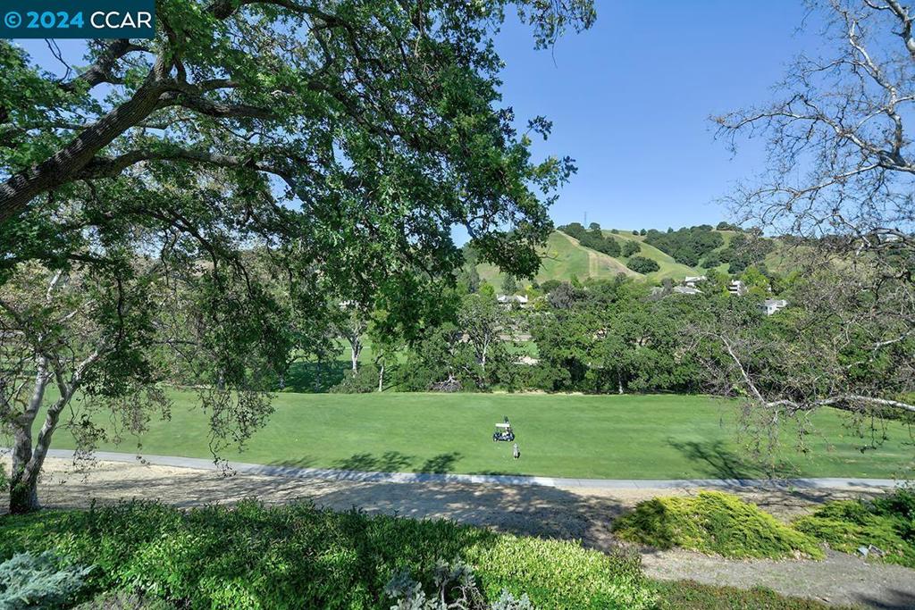 Beautiful Expansive Views in private setting on #15 hole of the Rossmoor Golf Course. Back patio has a wrought iron fence enclosed with a gate (perfect for a pet). Upgrated stainless appliances and New full size washer/dryer in unit. Energy efficient dual pane windows. Plus, large built-in extra storage cabinets in the primary. This Piedmont model is the largest floorplan of the Co-op. Three bedrooms (or office) with 2 1/2 baths. 1739 sq.ft. This unique location has the neighbors unit staggered behind for a very private setting.