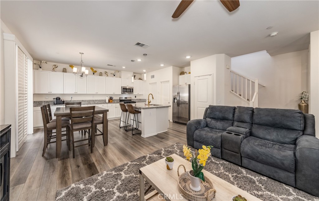 This stunning 3-bedroom, 2.5-bathroom home offers 1,717 sq. ft. of comfortable living space with upgraded flooring, recessed lighting, and an open floor plan perfect for entertaining. The kitchen features a spacious pantry and upgraded countertops, while the primary suite boasts a generous walk-in closet and private bath.Enjoy a two-car garage, beautifully maintained grounds, and resort-style community amenities including an in-ground pool and playground ideal for relaxation and recreation.