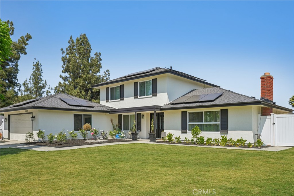 Welcome to 15235 Rolling Ridge Drive – a beautifully remodeled and highly upgraded residence that combines modern elegance with everyday comfort. From the moment you step inside, you'll be impressed by the attention to detail. The spacious living room features luxurious wood laminate flooring, recessed lighting, and a striking quartz slab fireplace with a custom mantel – setting the tone for the quality found throughout the home. The heart of the home is the stunning chef’s kitchen, showcasing custom wood cabinetry, soft-close drawers, a large center island, and a sleek modern sink with dual waterfall faucets. Outfitted with premium Forno appliances – including an eight-burner stove with griddle, dual oven with convection and air-fry features, a custom vent hood, built-in refrigerator, and dual-drawer beverage cooler – this kitchen is ready for culinary creativity and entertaining alike. Downstairs, you’ll find a spacious family room with dual chandeliers, a remodeled full bathroom with quartz countertops and gold fixtures, a large walk-in closet, and a luxurious primary suite. The suite includes custom wall treatments, crown molding, a chandelier, ductless A/C, and a spa-like en-suite bathroom with a walk-in shower and bench seating. Step outside from the primary suite into a private courtyard that leads to an additional bedroom – also featuring ductless A/C. A bright and versatile sunroom adds extra living space perfect for a gym, office, or game room. The stairs leading to the second floor are adorned with a custom gold vine railing and oversized windows bringing in warm natural light. Three more generously sized bedrooms and another beautifully upgraded bathroom complete the second level. This home is more than just beautiful – it's smart and efficient. Major systems including the roof, electrical, plumbing, and insulation have all been replaced. Enjoy the benefits of solar panels and two Tesla Powerwalls for reliable energy savings and peace of mind. The fully fenced front yard enhances privacy and security, while the backyard offers a garden area and a cross-fenced section ideal for pets. A shed/workshop with electricity is perfect for hobbies or storage. The gated driveway and attached two-car garage offer ample parking. Located in a desirable neighborhood close to shopping, schools, and amenities – and with no HOA or Mello-Roos – this home is a rare find. Step into comfort, quality, and a true sense of home. Don’t miss this incredible opportunity!