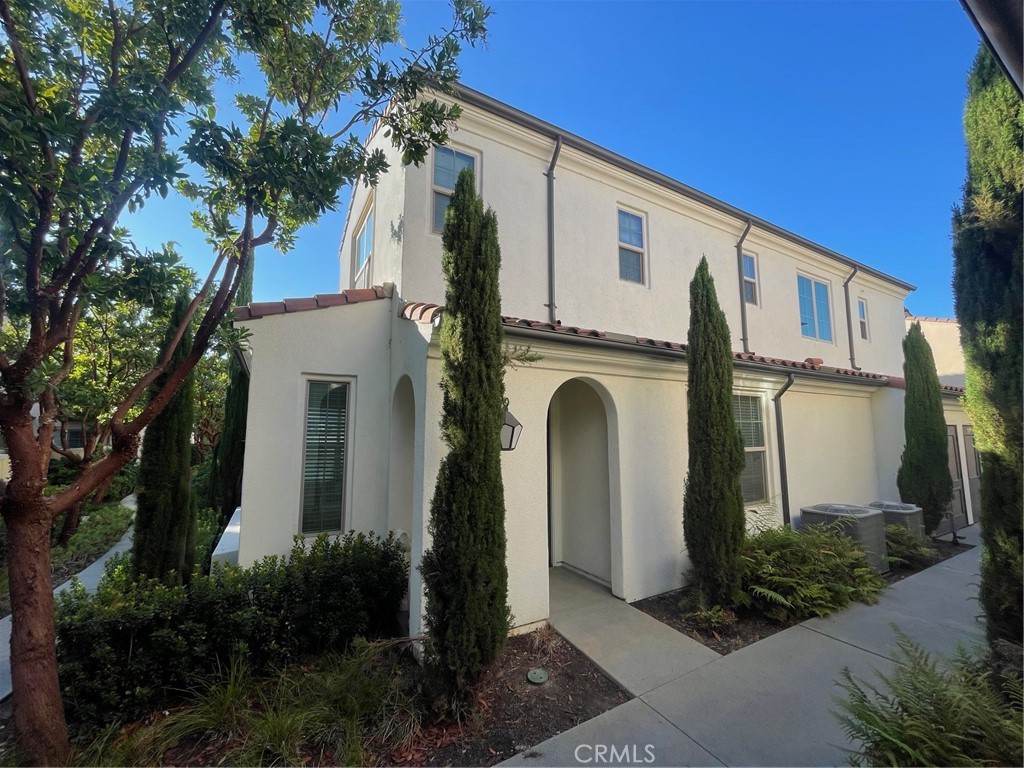 The Great location of Irvine cypress village community. Super cozy unit is awaiting their new residence. The most popular plan comes with downstairs main bedroom with full bath. It is with spacious living room, dining nook, and gourmet kitchen with contemporary white cabinetry, beautiful quartz. countertops, tile backsplash, stainless steel appliances, and large kitchen island. Beautiful Laminate flooring downstairs. Upstairs features two good size bedrooms, the primary suite with spa-like bathroom: dual sinks, large step-in shower, and walk-in closet. Ceiling Fans in all Bedrooms. Enjoy the private patio space for entertaining and BBQs. Top shelf Cypress Village amenities include private community parks, Jr. Olympic pools, jacuzzies, tot lots, and award-winning schools Cypress Elementary and Jeffrey Trails Middle school. You are also close to the Great Park, Irvine Spectrum, Woodbury Town Center, Cypress Village Shopping Center, and 5 Freeway. It will not stay long.