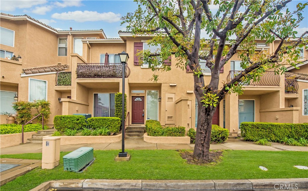 Welcome to 1041 S Positano Ave, a charming condominium nestled in the desirable Monaco community in Anaheim Hills. This inviting home offers 2 bedrooms and 3 bathrooms across 1,205 square feet of well-designed living space. Step inside to find a cozy atmosphere with large windows that flood the home with natural light. The living room features a warm fireplace, perfect for relaxing on cooler evenings. The kitchen is both functional and stylish, with sleek quartz countertops that offer ample workspace for preparing meals. The spacious master suite is a peaceful retreat, complete with an en-suite bathroom for ultimate convenience. You’ll also appreciate the private balcony, offering a quiet spot to unwind and enjoy the surrounding views. The attached two-car garage provides direct access to the home, along with additional storage space. Residents of the Monaco community enjoy access to a beautiful swimming pool, ideal for socializing or simply relaxing in the sun. With its prime location, this condominium is close to top-rated schools, including Canyon Rim Elementary, and offers easy access to local shopping, dining, and parks. For nature lovers, nearby attractions like Oak Canyon Nature Center and Santiago Oaks Regional Park offer endless outdoor recreation opportunities. Whether you’re seeking a tranquil retreat or a convenient location close to amenities, this condo offers the best of both worlds. Don’t miss the chance to make this your new home—schedule a viewing today!