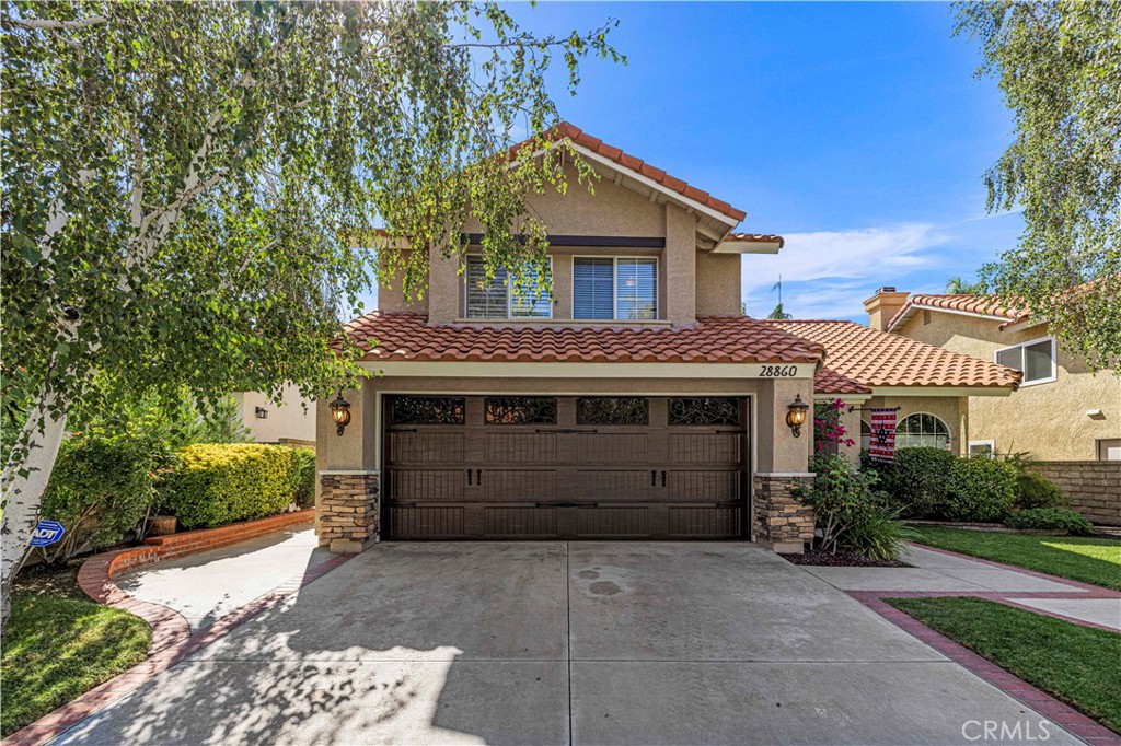 Truly Picture Perfect Curb Appeal on this Exceptional 4+3 Mediterranean Home. Located on a Beautifully Landscaped Lot, this immaculate home is ready to go! OOZING with Charm, the entry opens to Vaulted Ceilings in the Living & Dining Rooms, and Boasts Neutral Decor, Luxury Plank Vinyl Flooring & Plush Carpeting, Ceiling Fans, Recessed Lighting, One Bedroom and Full Bathroom Down, Family Room, and Center Island Kitchen. Recent Improvements include an Almost New Roof, Freshly Painted Exterior, Decorative Stone Accents, New Garage Door, and Terraced Backyard Landscaping. The second floor boasts a Spacious Primary Suite with High Ceilings, Expansive Windows and a Large Primary Ensuite Bath with Double Vanity, Spa Tub, and Expansive Walk-In Closet. There Two Additional Bedrooms with High Ceilings and a Double Vanity Bathroom upstairs. NO HOA, NO Mello Roos!