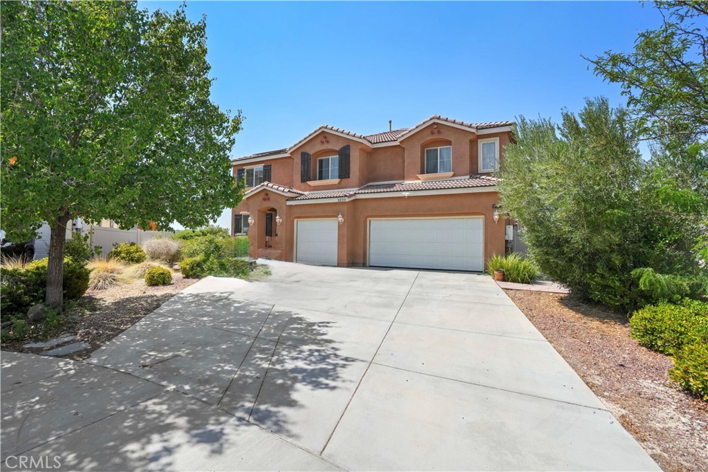 Welcome to this spacious West Lancaster cul-de-sac home! Set on a lot over 10,000 sq ft, this 5-bedroom, 3-bath home offers more than 4,400 sq ft of living space, a 3-car attached garage, and a wide driveway with parking for up to six cars. Inside, double front doors open to a grand foyer and a living room with soaring two-story ceilings. The open floor plan features a family room next to the kitchen with a large island, granite countertops, plenty of cabinets, walk-in pantry, and two dining areas. The first floor also has one bedroom, a separate full bath, and an oversized laundry room that can double as extra storage or a home gym. Upstairs, there are four bedrooms, each with a walk-in closet. The primary suite includes a dual-sink vanity, large walk-in closet, full bath, and a private office. The extra-large second bedroom fits two beds plus a play area.
The backyard and side yard is massive, with a new covered patio, play area, and low-maintenance front landscaping. Some areas are unfinished, giving you space to design your own outdoor retreat. A brand-new leased solar system offers energy savings for years to come.
Close to schools, parks, and shopping, this home offers plenty of space, and comfort.