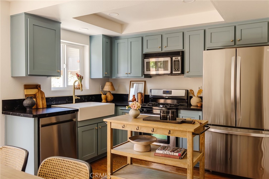 If you love Pasadena for its charm, character, walkable streets, and proximity to top-notch restaurants and shops, you’ll adore this sweet and stylish condo. Tucked into the highly sought-after Madison Heights neighborhood, this ground-floor unit breaks the typical condo mold with a charming craftsman-inspired exterior and an equally charming and delightful interior. With 3 bedrooms and 2 bathrooms, it offers just the right blend of comfort, convenience, and functionality. The open-concept layout connects the living room, dining area, and kitchen—perfect for easy weeknight living or casual entertaining. Both guest bedrooms are well-sized with nice closet space and share a full hall bathroom, while the primary suite enjoys dreamy natural light and a private en-suite bath. This unit also includes use of a spacious back patio (ideal for morning coffee or dining al fresco), in-unit laundry, and two dedicated parking spots. Prefer a walkable lifestyle? This location is a dream. Turn right for a stroll down some of Pasadena’s prettiest, tree-lined streets, head left and you’re just minutes from Trader Joe’s, Sidecar Donuts, Starbucks, Shake Shack, BevMo, ArtCenter, and quick access to the 110 Freeway. Don’t miss the chance to make this special home your own.