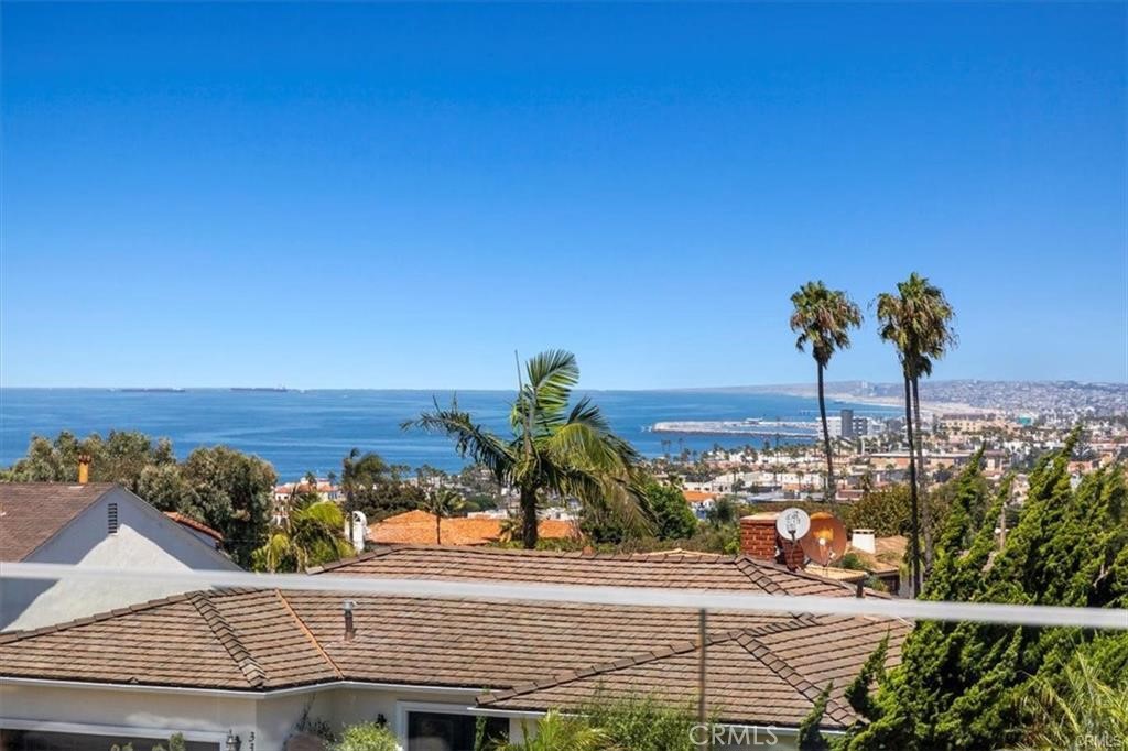 WOW! Stunning ocean-view lease in the Hollywood Riviera! Rarely available, this 4-bedroom, 3-bath Cape Cod–style home offers sweeping Queen’s Necklace views from the South Bay beaches to Malibu and across to Downtown Los Angeles. Perched above Riviera Village and Torrance Beach, you’re less than a mile from shopping, dining, and the sand.
Completely remodeled in 2018 and recently refreshed, this 2,462 sq. ft. home features wide-plank oak wood floors, a bright and open great room with living, dining, and a chef’s kitchen—perfect for entertaining. Step out to the spacious deck with outdoor heaters and enjoy year-round sunset views. The gourmet kitchen is equipped with a Wolf double oven and 6-burner range, Sub-Zero refrigerator and freezer, and a walk-in pantry.
The home includes central A/C and heating, an indoor elevator from the garage to the main level, a den, and a modern laundry room. The garage level offers a space ready for a wine cellar. The landscaped backyard is mostly flat with garden terraces—ideal for outdoor living or creative design touches.
Come experience one of the best view homes in the Riviera—available now for lease!