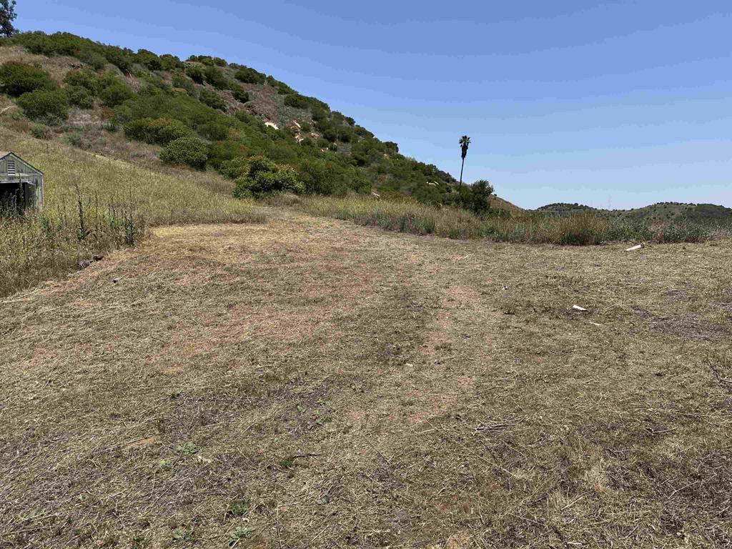 About 1 acre +/- is level and slightly sloping on the first ridge with beautiful views, just cleared the paths so it's an easy hike to the ridge - a perfect spot for your dream home! 20 Acres • Soft Pad Site • Wells On Property • 2-Inch Water Meter • 50,000-Gallon Tank • 270° Views • Near Town • Organic-Ready • 15% Down Financing Available. About a 3rd of the way up you'll find a beautiful site perfect for your future home! Much of the land is fenced and gated. Multiple flat locations on top offer breathtaking 270° views, stretching all the way to Pechanga Casino, making this an ideal location for building a custom home. The property also has the potential to be split into two 10-acre lots. Untouched by chemicals for over eight years, the land is ready for organic farming certification. Just minutes from Old Town Temecula and I-15 = easy access to shopping, dining, and entertainment. • 15% down financing source available • Virtual Tour Available!