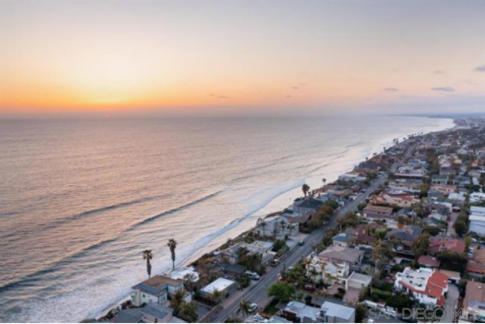 Stunning oceanfront home perfectly located atop the bluffs of Leucadia with private stairs to a beautiful stretch of beach and some of the best surf in town. Meticulously maintained to the highest standard with high quality upgrades throughout, including a new roof, new dual zone A/C, private hot tub, and a rare 4 car garage. From the minute you enter the property you will experience a level of privacy that is unrivaled in the area. Wake up to the sounds of the surf from the enormous master retreat, which invites a sense of serenity as you gaze out upon the majestic ocean. Multiple outdoor decks, patios, and balconies all have been expertly designed to take in the panoramic ocean views, maximize privacy, and create (see supplement) an inviting flow between indoor and outdoor living. Neptune is the pinnacle of oceanfront living; where an active lifestyle, effortless luxury, and constant connection to mother nature are all at your fingertips. It truly doesn't get any better than this! Architectural Style: Custom Built View: Custom Built Equipment: Dryer,Garage Door Opener,Pool/Spa/Equipment, Washer Sewer: Sewer Connected Frontage: Ocean/Bluff