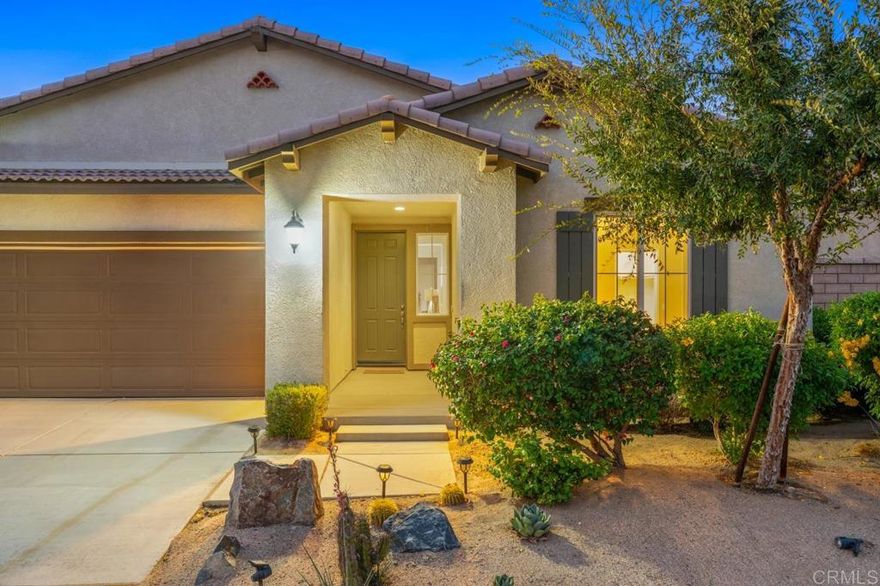 Welcome to Sonora Wells, one of Indio’s most desirable gated communities! This beautifully upgraded single-level home offers nearly 2,800 square feet of open living space with 4 bedrooms, 3 baths, plus a flex room — perfect for a home office or den.  Step through the formal entry into a bright, spacious layout featuring 18” tile flooring, plantation shutters, and elegant recessed lighting throughout. The chef’s kitchen is designed for entertaining, complete with stainless steel appliances, beautiful countertops, tile backsplash, walk-in pantry, center island, and breakfast bar that flows seamlessly into the breakfast nook, family room, and living room with a cozy tile fireplace.  The primary suite is a true retreat with a luxurious ensuite bath featuring dual vanities, soaking tub, separate shower, and large walk-in closet. Three additional bedrooms and two full baths provide plenty of space for family or guests.  Enjoy year-round desert living in the private backyard oasis, offering low-maintenance landscaping, mature fruit trees, and a covered patio ideal for relaxing or dining al fresco. Energy-efficient solar panels keep utility costs low, and the 3-car garage provides ample storage and parking.  Residents of Sonora Wells enjoy resort-style amenities including a community pool, spa, playground, BBQ and picnic areas, and beautifully maintained greenbelts — all within a short drive to shopping, dining, golf, and the renowned festival grounds.  Don’t miss this exceptional opportunity to own a move-in ready home that blends comfort, style, and sustainability in the heart of Indio.