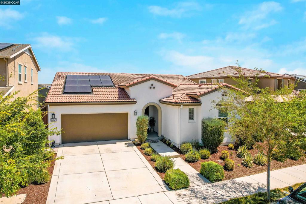 ATTENTION HOME SHOPPERS: Don’t Get Bamboozled by the Builder Bargain Hype! Sure, the builders nearby are slashing prices like it’s Black Friday—but what they’re really offering is a drywall box with “some assembly required.” No flooring? No landscaping? No thanks. Those “incentives” won’t cover the thousands you’ll need to make it livable. Meanwhile, THIS home? Fully upgraded, professionally designed, landscaped, and 100% move-in ready. No dirt lots, no DIY headaches, no surprises. Just pure, turn-key perfection. Welcome to 6856 Anton Street, a stunning 4 bed, 3.5 bath single-story home with 2,500+ sqft of open-concept living space. Built in 2019, this modern home features engineered hardwood flooring throughout, high ceilings, and custom blinds. Gourmet kitchen opens to spacious family and dining areas—ideal for entertaining. Luxurious primary suite with spa-like bath and walk-in closet. Owned solar system, hot tub, and built-in gas fire pit for relaxing outdoor living. Located in the vibrant Tracy Hills neighborhood with easy freeway access and walking distance to top-rated K-8 school, parks, clubhouse, community pool, and dog park. Turnkey and move-in ready—don’t miss this opportunity!