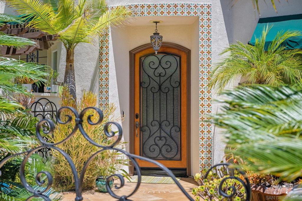 One of Rancho Carrillo’s most desirable estates, this rare .25-acre cul-de-sac property combines timeless elegance with modern luxury. Nestled in the coveted Haciendas village, it offers exceptional privacy surrounded by lush, mature landscaping. A charming courtyard entry introduces a stunning two-story turret foyer. Inside, rich hardwood floors, bright white walls, and exposed wood beams create a sophisticated designer look. The chef’s kitchen is a true showpiece, featuring a built-in refrigerator, double ovens, and a striking emerald-hued backsplash inspired by Rolex’s signature green. Each bedroom boasts its own private bath, including a versatile main-level suite ideal for guests or multi-generational living. Experience seamless indoor-outdoor living with a courtyard off the dining room for intimate gatherings. The backyard is an entertainer’s dream, complete with a saltwater pool and spa, a covered pergola with BBQ bar, and a spacious grassy lawn offering room for a future ADU. —it’s a statement of refined living in one of Carlsbad’s most sought-after communities. Upstairs, the luxurious primary retreat features a cozy fireplace, walk-in closet, and serene views, complemented by a loft perfect for an office, media lounge, or creative space. Additional highlights include a long, private driveway leading to a three-car garage, owned solar panels, a tankless water heater, and a whole-home water filtration system. This home isn’t just a residence—it’s a statement of refined living in one of Carlsbad’s most sought-after communities. Rancho Carrillo offers the perfect blend of convenience and natural beauty. Miles of walking trails and the Rancho Carrillo Swim Center complete with heated pool, spa, and clubhouse. Bressi Ranch Square just a stone's throw away, featuring a variety of fantastic restaurants such as Tommy V's, Giola, Casero, Panini Grill, Mendocino Farms, and Board & Brew. You'll also find all your shopping essentials nearby, with Trader Joe's, Stater Bros, Sprouts, Bevmo, CVS, Target, and Starbucks just around the corner. If you're looking to explore the great outdoors, Rancho Carrillo provides hiking trails for outdoor enthusiasts. Additionally, the historic Leo Carrillo Ranch is a treasure nearby, offering a glimpse into the past, a chance to explore the grounds, learn about Leo Carrillo himself, and partake in community events hosted by the City of Carlsbad.