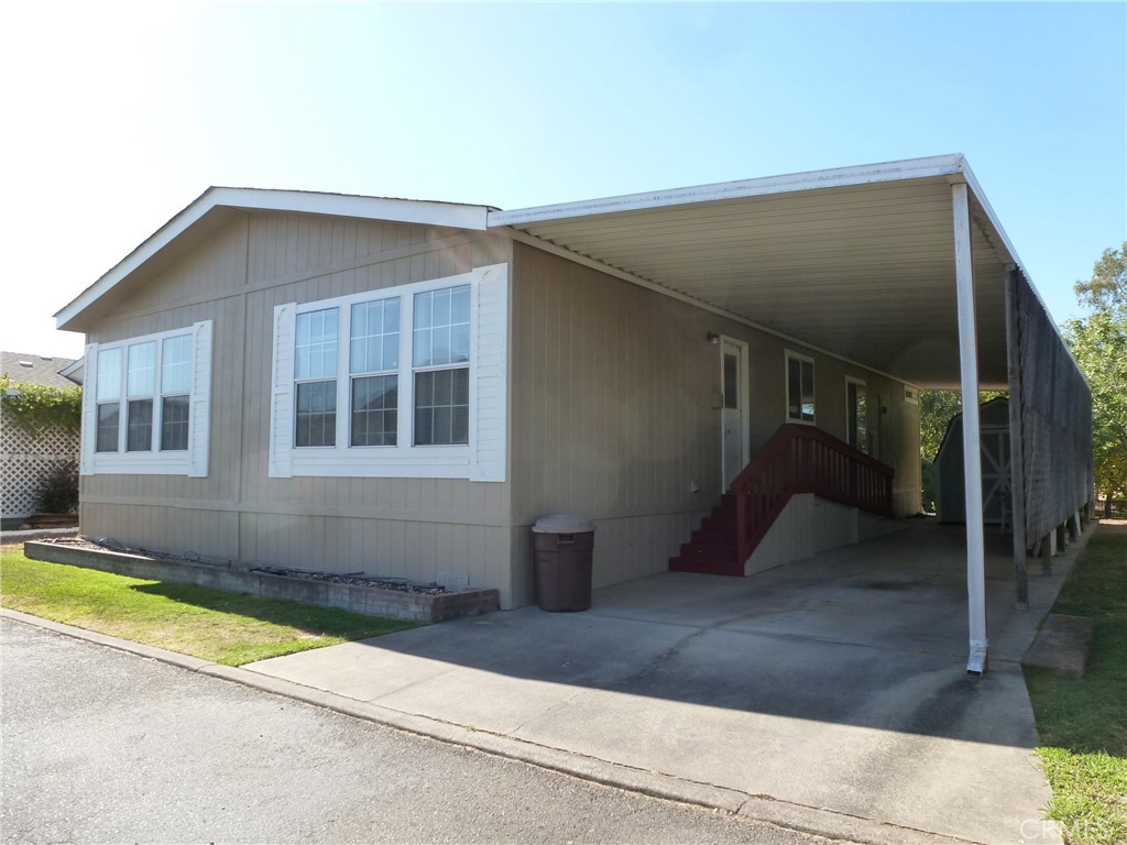FRESHLY PAINTED! This 3 bedroom Manufactured home in Dingerville has been repaired and repainted and it looks like new! Dingerville USA is a Senior Park for those 55 and older, with an in-ground pool and it's own golf course, plus an RV park for your visitors. This manufactured home has a split floor plan, with the primary bedroom and en suite bath bath separated from the other 2 bedrooms and bath by the living area. The kitchen features newer appliances, an abundance of cupboard and counter space and a breakfast bar, plus there is a large dining area, with more storage. The laundry is just off the kitchen, and includes a washer and dryer. The front deck is a great place to relax, and it has been recently recently repaired and the whole exterior of the home was freshly painted. A double-length carport provides off-street parking, and includes a ramp to the back door and a large shed. The park pool is close by. Water, sewer, and trash fees are included in the space rent. Dingerville USA is south of Oroville, just off Hwy 70.