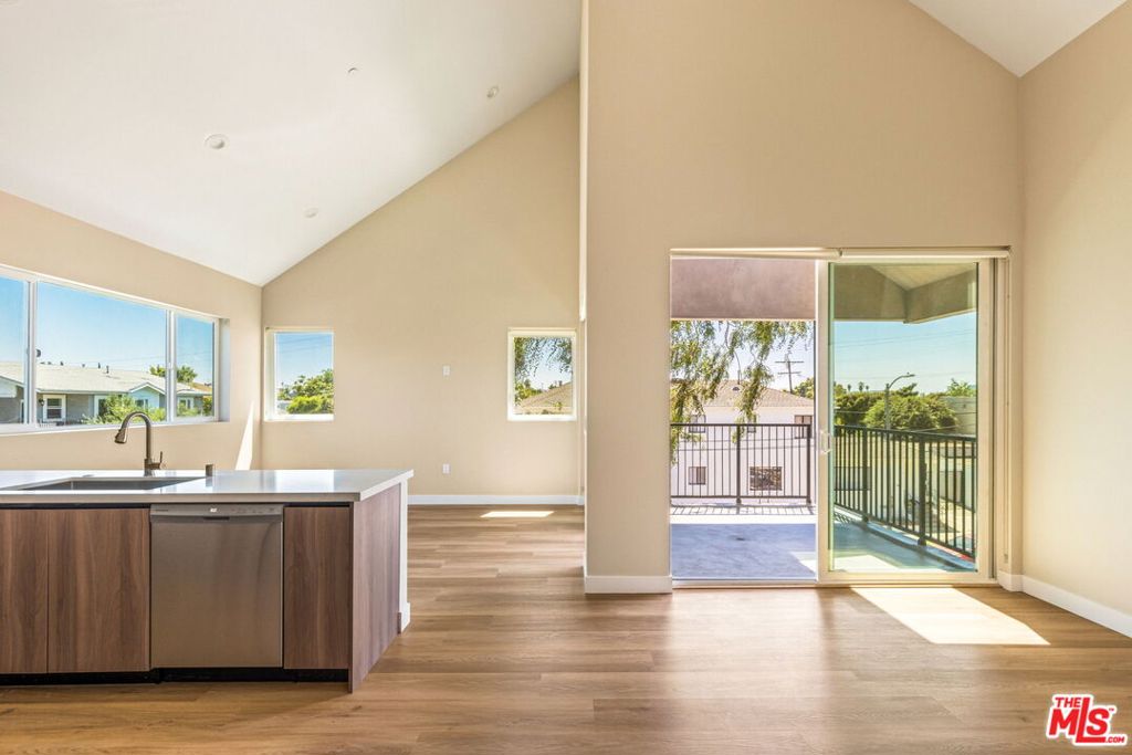 Welcome to Highland 5 - a brand new construction building with only 5 units, fully gated with secure entry and parking. This upper two bedroom, two bathroom unit features clean, modern design with spacious, light-filled interiors enhanced by elevated finishes like custom cabinetry and stone countertops. This unit features 18' pitch vaulted ceilings, wraparound windows, central heat and AC, plus private patio with city views. Fully equipped with in-unit washer and dryer, stainless steel appliances, and app controlled intercom system. Each unit has their own solar panels, which offer a substantial offset to your monthly electric bill! TWO gated tandem parking spots with remote controlled access. Rarely found privacy and level of finish in central LA. A chic, special place to call home, now available for immediate move-in. Walking distance to Sprouts and Target, plus easy access to the 10 freeway!