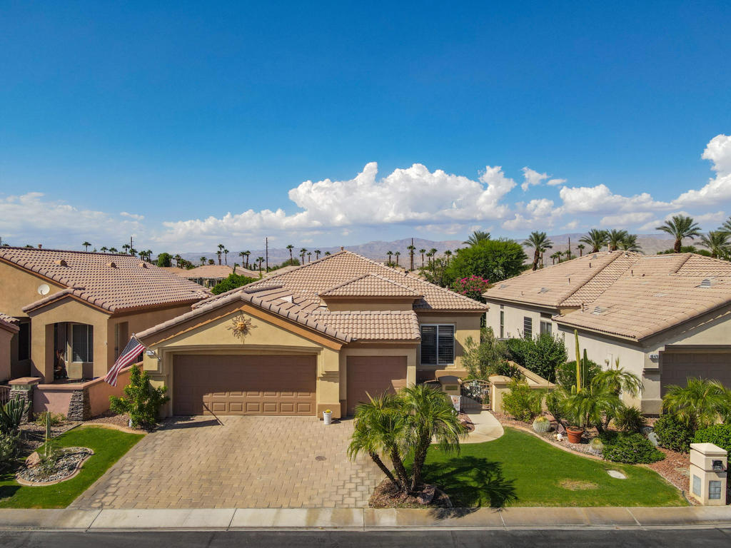 Stunning Golf Course & Mountain Views!Pride of ownership shows in this move-in ready home featuring the popular Merion floor plan, perfectly situated on the 10th fairway in Heritage Palms CC. Offering 2BD/2BA plus a den/office and 1,720 SF, this home highlights an Open Great Room design with a dramatic slab granite island, newer stainless steel appliances, tile flooring, carpeted bedrooms and plantation shutters. Recent upgrades include freshly painted interior, updated electrical panel and wiring with LED recessed lighting, ceiling fans, and more. The spacious primary suite showcases bay windows, a walk-in closet with custom organizers, and panoramic golf course views. Outdoors, enjoy a resurfaced north-facing patio with Alumawood cover and built-in gas BBQ, plus a pavered driveway that adds curb appeal. The garage offers epoxy flooring and a third bay for golf cart storage. Heritage Palms is a 55+ active adult community with championship golf, pools, tennis & pickleball, fitness center, and remodeled restaurant/bar. Resort-style living at its best!