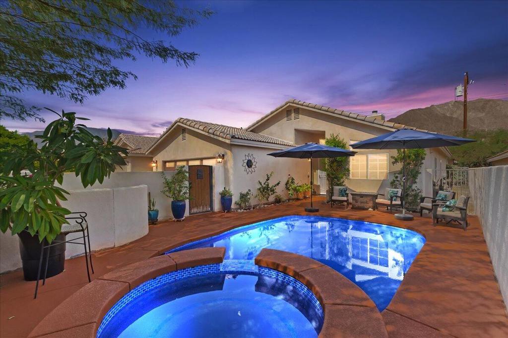 Welcome to your private desert oasis in La Quinta Cove! This spacious, larger than most Cove homes boost 1,800+ SQ ft. beautifully appointed 3-bedroom, 3-bathroom home combines comfort and luxury, offering a front court yard oasis, unique to the Cove, private, newly tiled and remodeled salt water pool and spa. Breathtaking mountain views day or night. Whether you're looking for a permanent residence, vacation home, or investment property, this La Quinta Cove gem is a must-see! Key features include bright living areas with large windows, a gourmet kitchen with stainless steel appliances and granite countertops, and inviting bedrooms. The primary suite has an en-suite bath with an extra large jacuzzi tub and direct access to the intimate backyard space. 5 year new 5 ton AC. Outside, enjoy a private pool surrounded by lush landscaping and breathtaking views, perfect for sun-soaked afternoons or evening gatherings under the stars. Situated in the highly desirable La Quinta Cove, you're minutes from hiking trails, world-class golf, and Old Town La Quinta's shops and restaurants. Additional features include high ceilings, granite countertops throughout, and a two-car garage with insulated doors. Don't miss this opportunity! Schedule your private tour today and experience desert living at its finest.