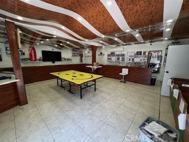 Property currently being utilized as a sports card/memorabilia shop. Newly remodeled with trendy modern look w/ recessed lighting, electrical system has also been updated with two new meters, 240 volts each. Property has a built-in safe w/ concrete enclosure. Property has a small kitchenet with a single Centrally located between Silver Lake and Los Feliz in east Hollywood. Existing tenant can stay with a new lease or may move out at the new owners wish. Located in a busy intersection surrounded by both other business and residential properties. Property has two addresses 3825/3827 fountain.