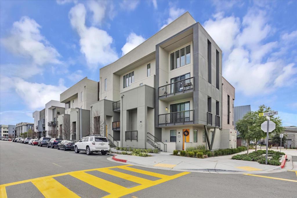 Come home to this contemporary 3-bedroom, 3-bathroom condominium in Fremont, California. This 2-story home built in 2020 offers 1,776 square feet of thoughtfully designed living space and an attached 2-car garage for parking and storage. The bright and inviting living room creates a welcoming space for relaxation and entertaining. Bathed in natural light from large windows and sliding glass doors, the room features an open layout with neutral tones that enhance its modern appeal. Stylish light fixtures lend a sophisticated touch, while the private balcony offers an outdoor retreat to enjoy Fremont's pleasant weather. At the heart of the home lies a beautifully crafted kitchen, boasting sleek white cabinetry, polished stone countertops, and a striking mosaic tile backsplash. The expansive island doubles as a breakfast bar, perfect for casual meals or hosting friends and family. Located in a thriving community, this home offers easy access to local amenities, shopping centers, and major transportation routes, making it ideal for both commuters and families. *Our homes come as-is with all essentials in working order. Want upgrades? Request it through the Belong app, and our trusted pros will take care of the rest! 1 dog Allowed Pet Deposit - $500